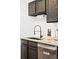 Kitchen sink with black faucet and granite countertops at 1503 S Buckley Way, Aurora, CO 80017