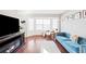 Spacious living room with hardwood floors, fireplace, and bay window at 1503 S Buckley Way, Aurora, CO 80017