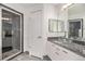 Updated bathroom with glass shower and granite vanity at 8757 E Dry Creek Rd # 1512, Englewood, CO 80112