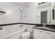 Clean bathroom with tub, shower, and granite vanity at 8757 E Dry Creek Rd # 1512, Englewood, CO 80112