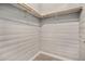 Large closet with wood shelving and hanging rods at 8757 E Dry Creek Rd # 1512, Englewood, CO 80112