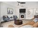 Living room with fireplace and hardwood floors at 8757 E Dry Creek Rd # 1512, Englewood, CO 80112