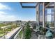 Relaxing balcony space featuring a grill and comfortable seating with city views at 5455 Landmark Pl # 1414, Greenwood Village, CO 80111