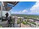 Enjoy breathtaking views from this spacious balcony with seating and contemporary railing at 5455 Landmark Pl # 1414, Greenwood Village, CO 80111
