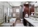 Well-lit bathroom with a soaking tub, tiled walls, modern vanity, and sleek fixtures offers a spa-like experience at 5455 Landmark Pl # 1414, Greenwood Village, CO 80111