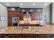 Well-equipped kitchen featuring granite countertops, custom cabinets, and stainless steel appliances at 5455 Landmark Pl # 1414, Greenwood Village, CO 80111