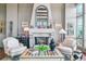 Cozy living room with a stone fireplace, seating, and decor for a relaxing atmosphere at 5455 Landmark Pl # 1414, Greenwood Village, CO 80111