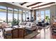 An open floor plan connects a living room and dining room featuring ample natural light and modern accents at 5455 Landmark Pl # 1414, Greenwood Village, CO 80111