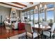 Open living space with a stone fireplace, dining table, and expansive windows offering scenic views at 5455 Landmark Pl # 1414, Greenwood Village, CO 80111