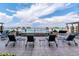 Relaxing rooftop terrace featuring comfortable seating, lounge chairs, a waterfall, and stunning views at 5455 Landmark Pl # 1414, Greenwood Village, CO 80111