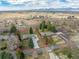 Sprawling property with mature trees, a fenced yard, and mountain views in a desirable location at 1723 Stonehenge Dr, Lafayette, CO 80026