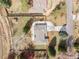 This aerial shot shows the home's roof, driveway and the generous yard with a storage shed at 1723 Stonehenge Dr, Lafayette, CO 80026