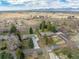 Breathtaking aerial view of a charming property showcasing its serene surroundings and mountain views at 1723 Stonehenge Dr, Lafayette, CO 80026