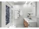 Bright bathroom includes a modern shower, towel warmer, and vanity at 1723 Stonehenge Dr, Lafayette, CO 80026