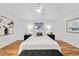 Spacious bedroom with a cozy bed, soft lighting, and tasteful decor at 1723 Stonehenge Dr, Lafayette, CO 80026