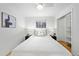 Clean bedroom features a large bed, white walls, and natural light, creating a serene atmosphere at 1723 Stonehenge Dr, Lafayette, CO 80026