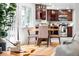 Cozy kitchen and dining nook with modern cabinets, natural light, and stylish dining table at 1723 Stonehenge Dr, Lafayette, CO 80026