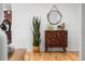 A decorative cabinet and potted plant are featured in this lovely entryway at 1723 Stonehenge Dr, Lafayette, CO 80026