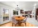 Charming kitchen with stainless steel appliances, wooden table, and backyard access at 1723 Stonehenge Dr, Lafayette, CO 80026
