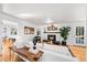 The home features a comfortable living room with hardwood floors and a cozy fireplace at 1723 Stonehenge Dr, Lafayette, CO 80026
