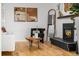 Inviting living room featuring hardwood floors, a stylish fireplace, and comfortable seating at 1723 Stonehenge Dr, Lafayette, CO 80026