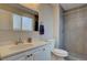 Bathroom features a tiled shower, modern fixtures and neutral colors at 7249 S Iris Ct, Littleton, CO 80128