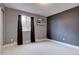 Bedroom boasts neutral colors and window bringing in the outdoors at 7249 S Iris Ct, Littleton, CO 80128