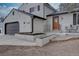 Charming two-story home featuring a brick exterior, a well-manicured lawn, and a two-car garage at 7249 S Iris Ct, Littleton, CO 80128