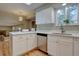 Bright kitchen with white cabinets, stainless steel appliances, and quartz countertops at 7249 S Iris Ct, Littleton, CO 80128