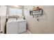 Convenient laundry room with washer, dryer, and ample storage space at 8925 Apache Plume Dr, Parker, CO 80134