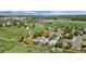 An aerial view of houses with parks and sports complex in the background at 11335 W 54Th Ln, Arvada, CO 80002