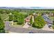Aerial view of the house in its neighborhood with trees and a long driveway at 11335 W 54Th Ln, Arvada, CO 80002