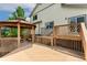 Wooden deck and gazebo highlight this outdoor space, with stairs leading to backyard at 11335 W 54Th Ln, Arvada, CO 80002