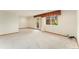 Open carpeted basement with a walk-out doorway and a window for ample natural light at 11335 W 54Th Ln, Arvada, CO 80002