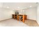 Open basement featuring a kitchenette and shelving perfect for entertaining at 11335 W 54Th Ln, Arvada, CO 80002