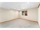 Unfinished basement with a single window providing natural light to the neutral color palette at 11335 W 54Th Ln, Arvada, CO 80002