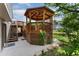An outdoor gazebo on a wooden deck with lattice trim, and a nearby hot tub at 11335 W 54Th Ln, Arvada, CO 80002