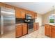 Bright kitchen featuring stainless steel appliances, wood cabinets and granite countertops at 11335 W 54Th Ln, Arvada, CO 80002