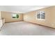 Expansive loft space with neutral carpet and two windows offering natural light at 11335 W 54Th Ln, Arvada, CO 80002
