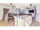 Open kitchen with a granite island, stainless steel appliances, and a breakfast bar, perfect for entertaining at 16160 E 119Th Ave, Commerce City, CO 80022