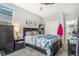 Comfortable bedroom with neutral tones, closet, and a view into the ensuite bathroom at 16160 E 119Th Ave, Commerce City, CO 80022