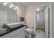 Modern bathroom features a stylish vessel sink, granite countertop, and adjacent laundry area at 1769 W 113Th Ave, Denver, CO 80234