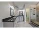 Bright bathroom with granite countertops, cabinets, and large glass shower at 1769 W 113Th Ave, Denver, CO 80234