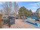 Outdoor deck featuring a built-in grill and comfortable seating around a fire pit for entertaining at 1769 W 113Th Ave, Denver, CO 80234