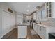 Stylish kitchen featuring an island, stainless steel appliances, and white cabinetry at 1769 W 113Th Ave, Denver, CO 80234