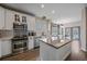 Modern white kitchen with stainless steel appliances and ample counter space at 1769 W 113Th Ave, Denver, CO 80234