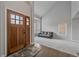 Bright living room with new carpet, large windows, and a stylish front door at 1769 W 113Th Ave, Denver, CO 80234