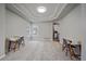 Spacious living room area featuring carpeted floors and tray ceiling detail at 1769 W 113Th Ave, Denver, CO 80234