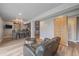 Basement rec room featuring wood flooring, an accent wall, and a wet bar, perfect for entertaining guests at 1769 W 113Th Ave, Denver, CO 80234