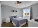 Comfortable bedroom featuring a large window, neutral decor, and ample natural light at 2432 S Genoa Way, Aurora, CO 80013